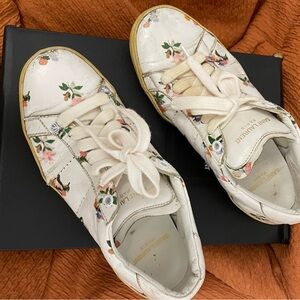 Saint Laurent leather sneakers with flowers. Absolutely adorable!